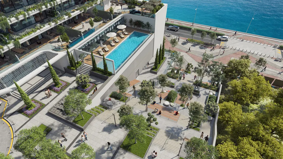 Large swimming pool and landscaped leisure area at Reportage Tower offering resort-style amenities for residents.