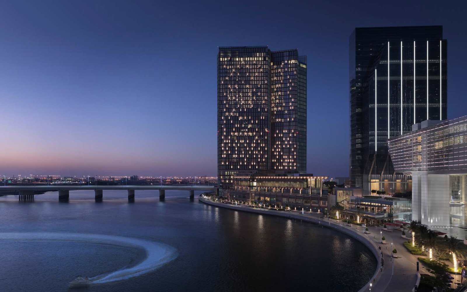 Evening illumination of Four Seasons Hotel Abu Dhabi striking architectural lighting on Al Maryah Island